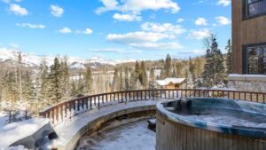 Panoramic mountain views from outdoor hot tub at Inspirato home, Lynx, in Telluride, CO.