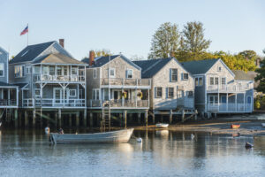 Back of grayish blue, waterfront homes with private docks in Nantucket, Massachusetts.