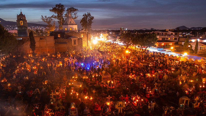 Illuminated crosses in a graveyard during a Día de los Muertos festival in Mexico City.