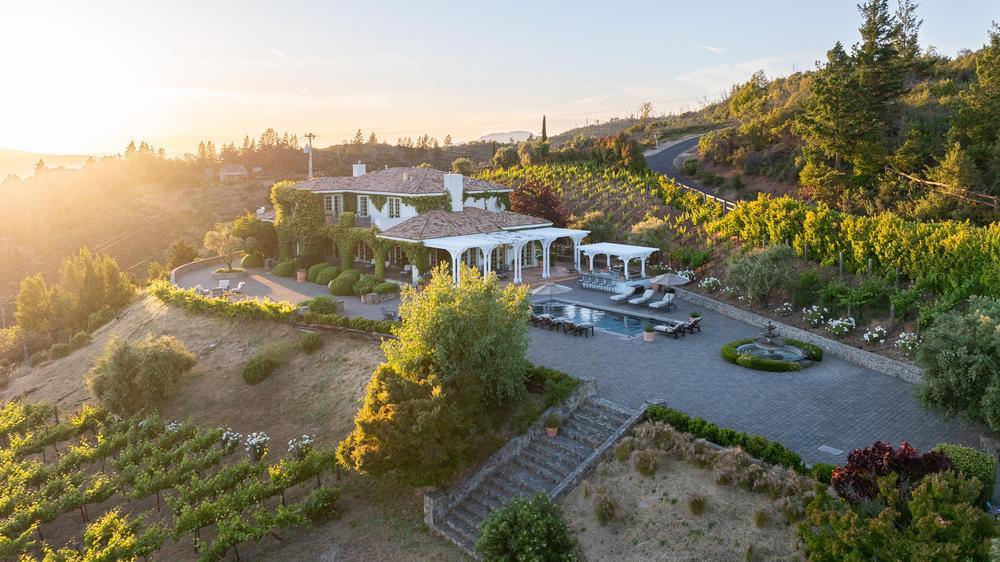 Exterior of Villa Della Luna property with surrounding vineyard, pool area all in the Sonoma countryside.