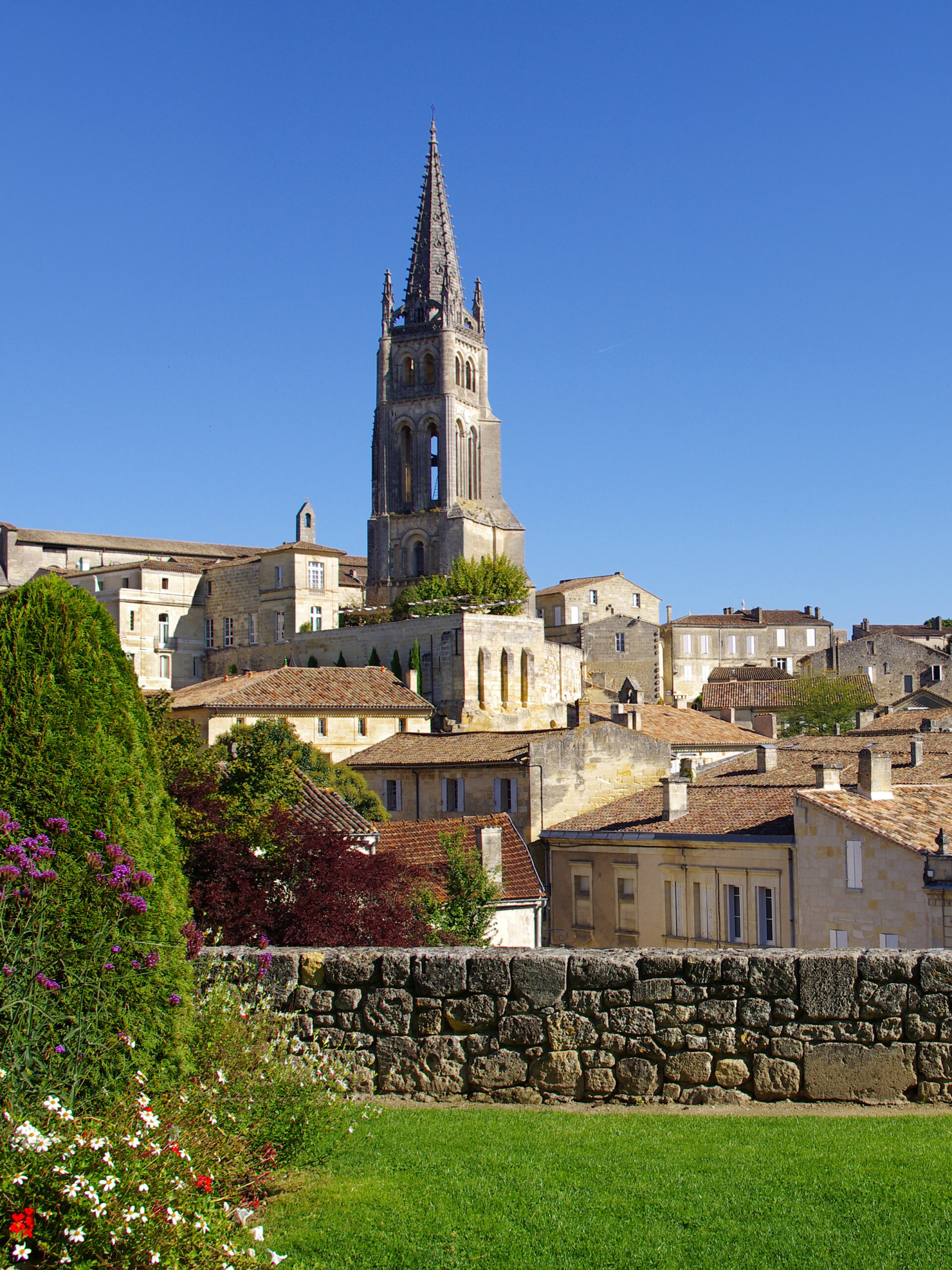 The elegant façade Bordeaux surrounded by blooming roses.