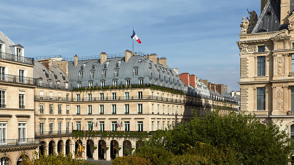 Elegant exterior of Hôtel Regina in Paris, France, showcasing classic Haussmann architecture near the Louvre—an iconic setting for a cinematic Parisian escape.