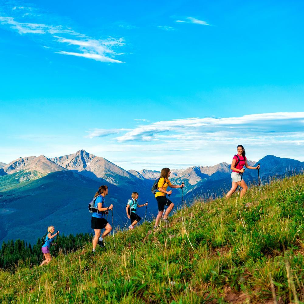 Family hiking in the mountains surrounding Vail