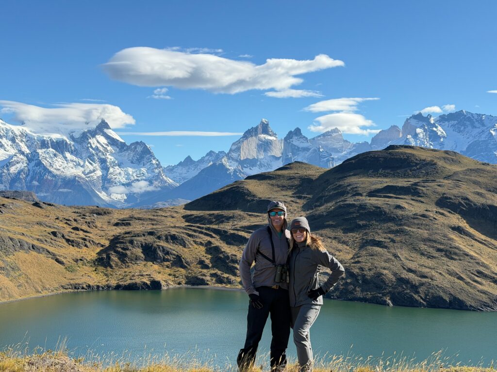 The Baders posing for the camera in front of a stunning mountain landscape in Patagonia