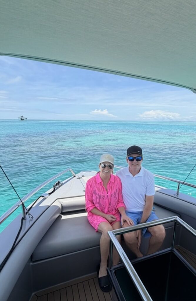 Mr. and Mrs. Willis smiling on a boat off the coast of Australia