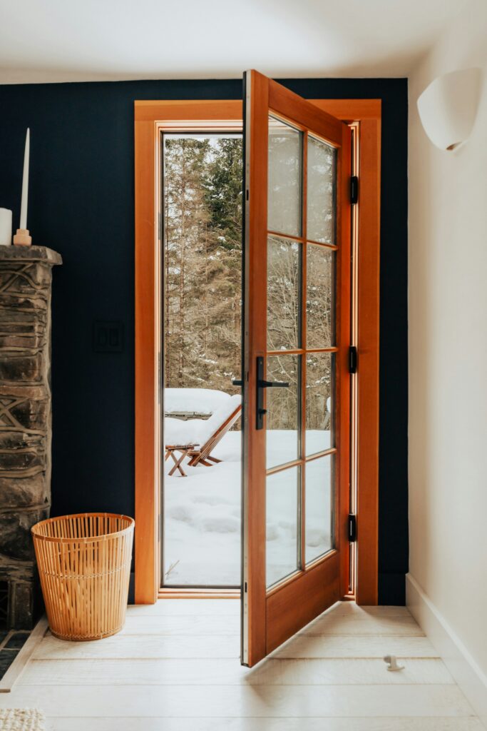 Interior of a cozy alpine escape with the door ajar
