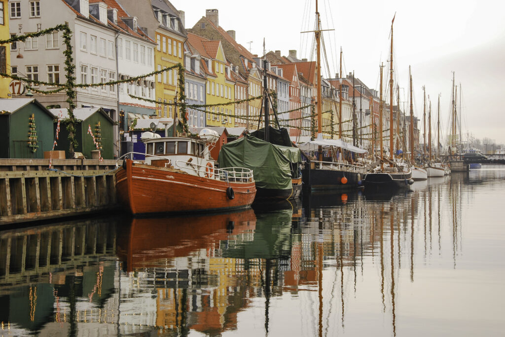 Colorful houses and yachts of Nyhavn, Copenhagen, decorated for the holidays