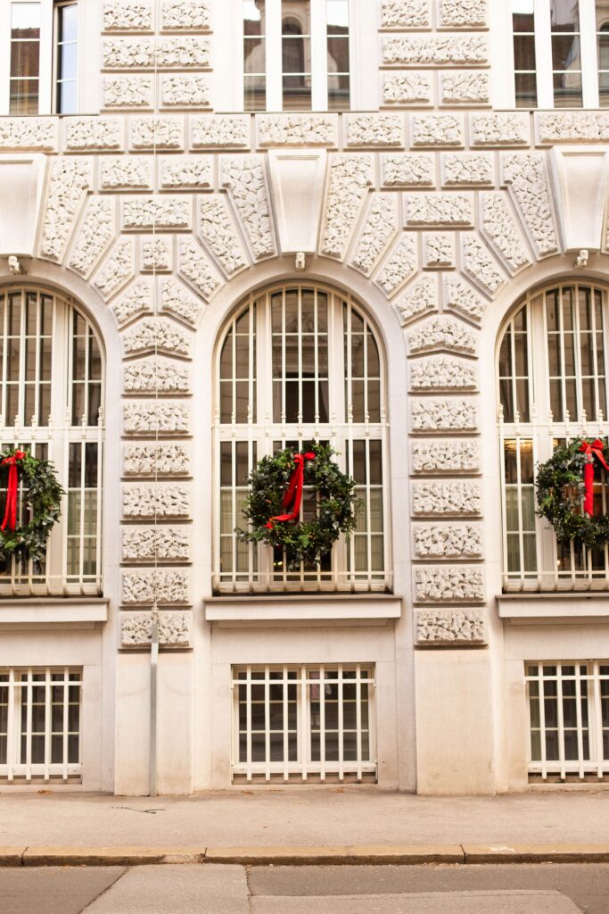 A beautiful old building decorated with holiday wreaths