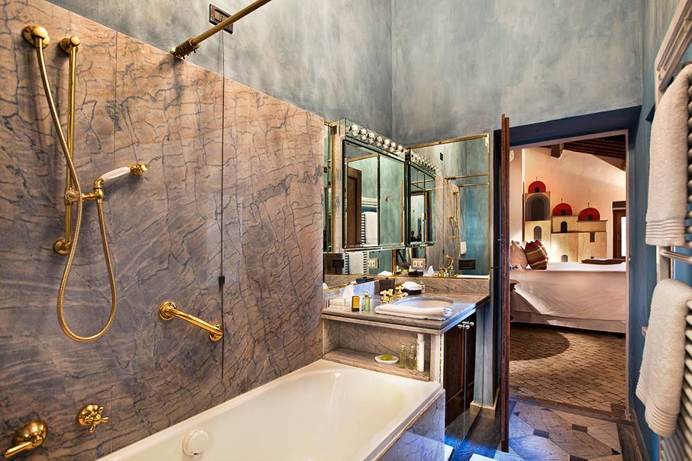 Interior of Basilica di Santo Spirito showcasing Brunelleschi’s architectural design with high ceilings and symmetrical arches.